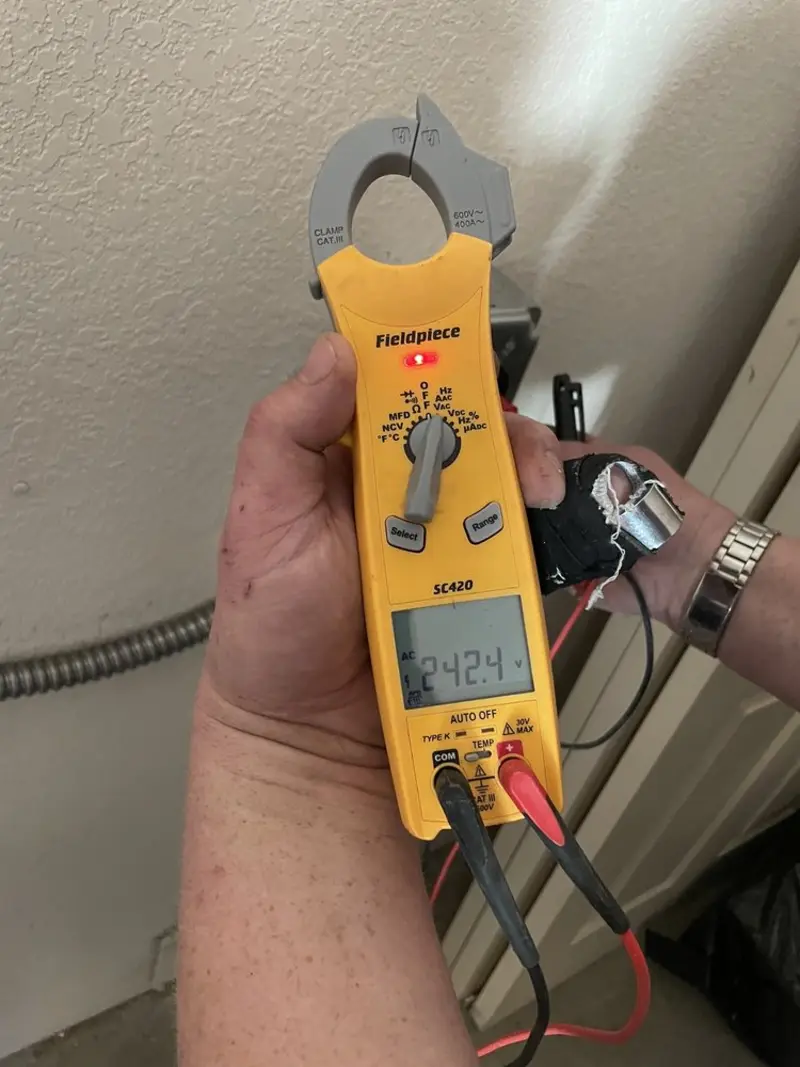 Voltage testing with clamp meter during Recessed Lighting Installation in Loudon